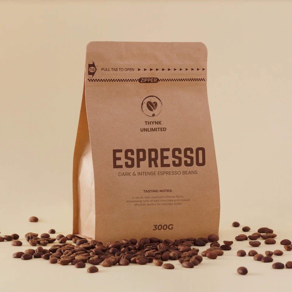 brown-kraft-paper-coffee-bag-labeled-espresso-surrounded-by-scattered-coffee-beans-on-beige-surface